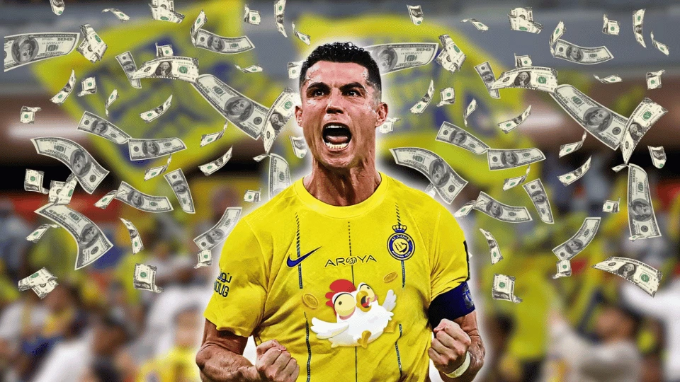 Money falls on Cristiano Ronaldo wearing a t-shirt with the Chicken Road logo